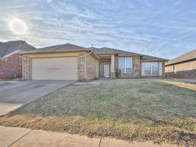 view of front of house with a garage and a front lawn