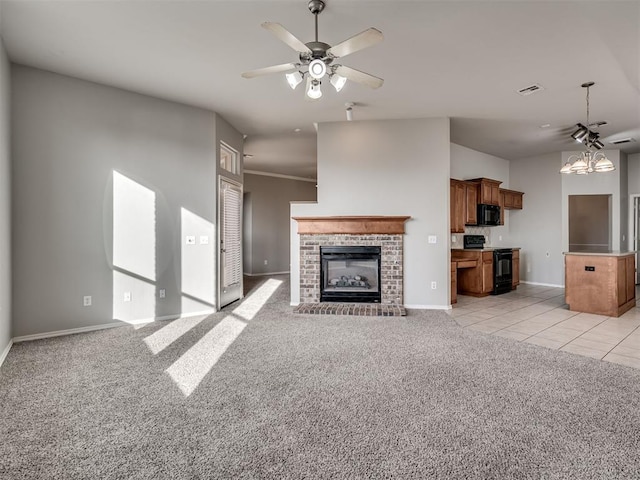 unfurnished living room with light carpet, a fireplace, and ceiling fan