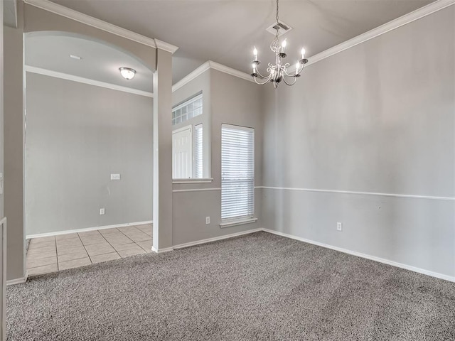 carpeted empty room with crown molding and an inviting chandelier