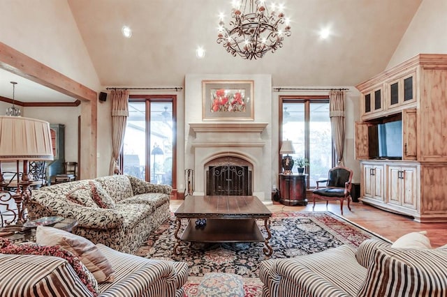 living room featuring high vaulted ceiling, a wealth of natural light, and light hardwood / wood-style floors