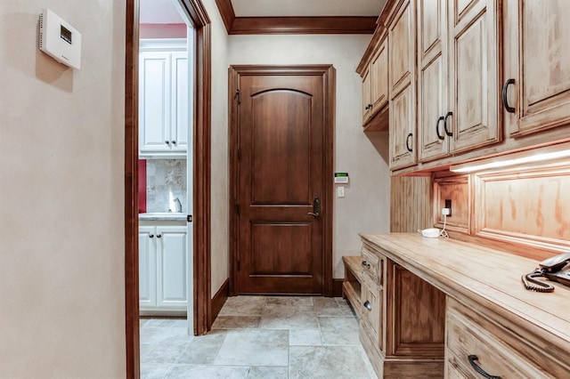 interior space with crown molding