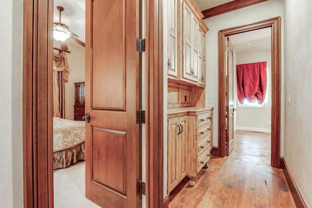 corridor with light hardwood / wood-style flooring