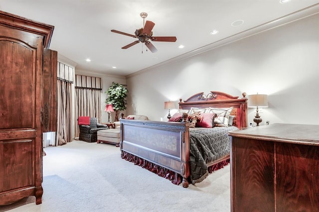 bedroom featuring crown molding, ceiling fan, and light carpet