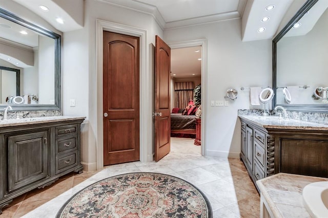 bathroom featuring vanity, tile patterned floors, and crown molding