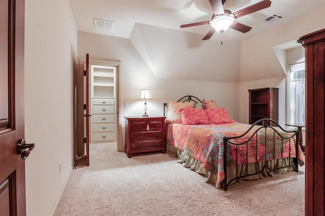 bedroom featuring light carpet, lofted ceiling, and ceiling fan