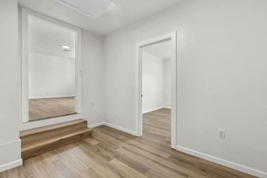 unfurnished room featuring light hardwood / wood-style flooring