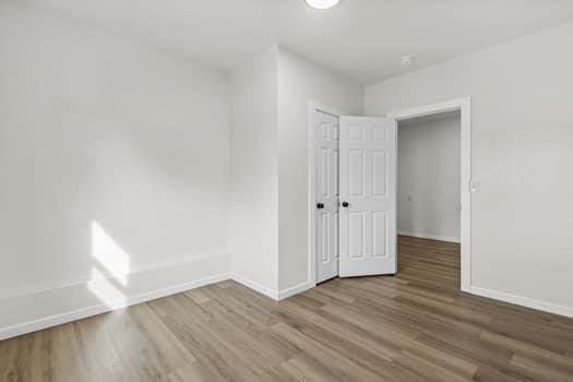 spare room with hardwood / wood-style floors