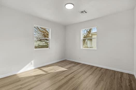 empty room featuring hardwood / wood-style floors