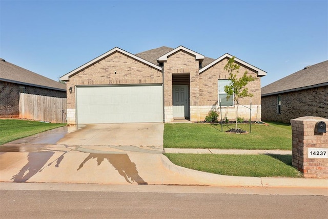 view of front of property featuring a garage and a front yard