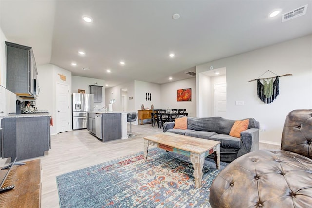 living room with light hardwood / wood-style floors