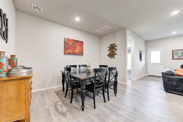 dining room featuring light hardwood / wood-style flooring