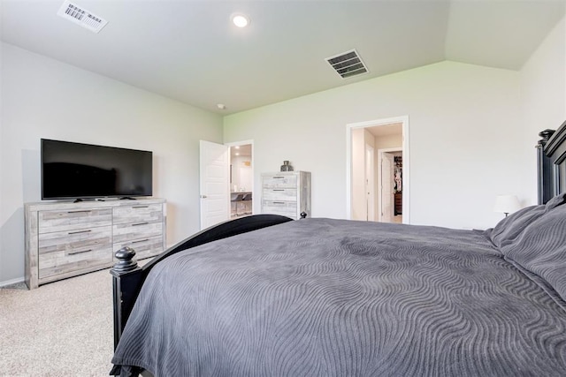 bedroom featuring vaulted ceiling and carpet floors