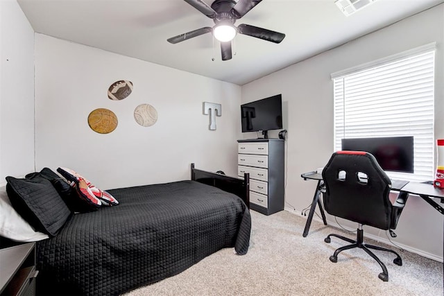 bedroom featuring light carpet and ceiling fan