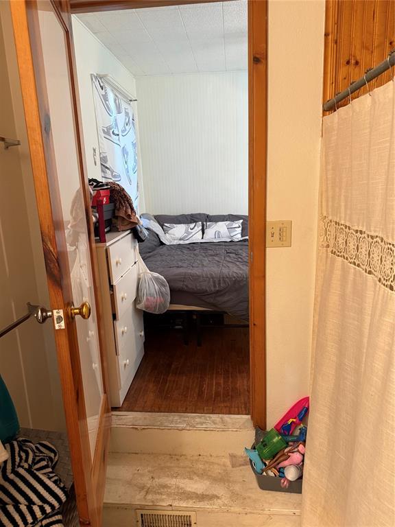 bedroom with wood finished floors