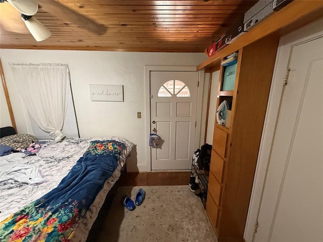 bedroom featuring wooden ceiling and a ceiling fan