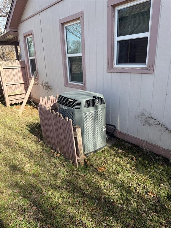 exterior details with fence and cooling unit