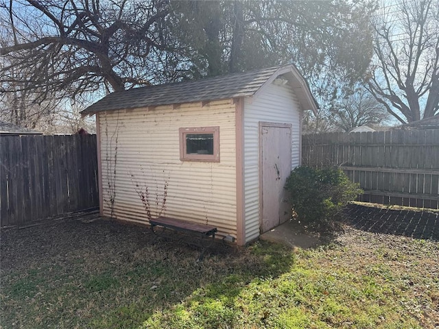 view of shed featuring a fenced backyard