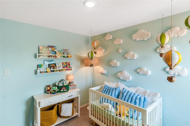 carpeted bedroom featuring a crib