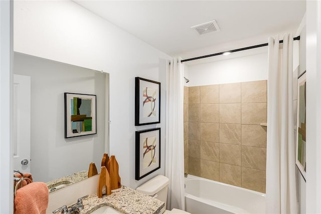 full bathroom featuring vanity, toilet, and shower / bath combo