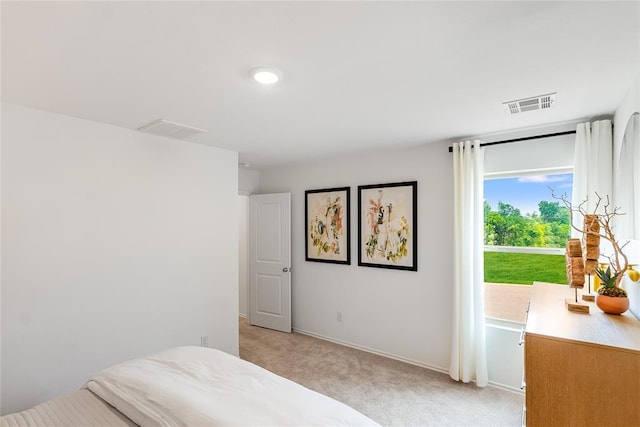 bedroom with light carpet