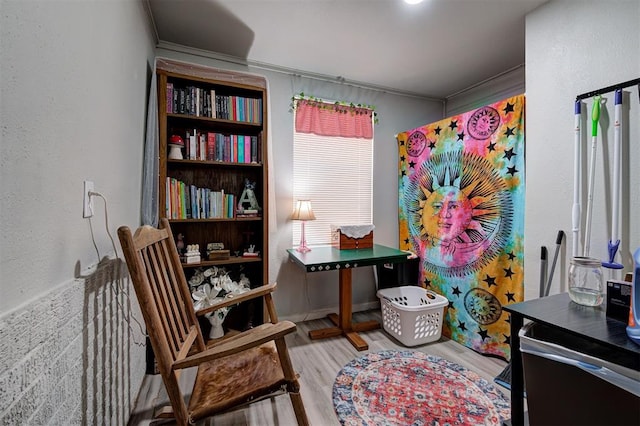 rec room featuring crown molding and hardwood / wood-style flooring