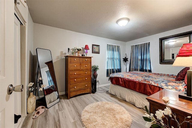 bedroom with light hardwood / wood-style floors