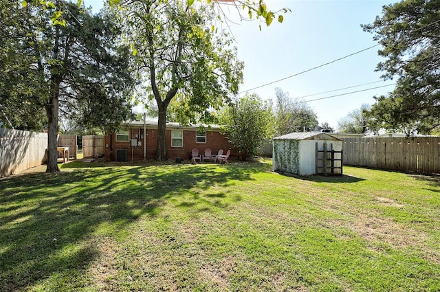 view of yard with a shed and central air condition unit