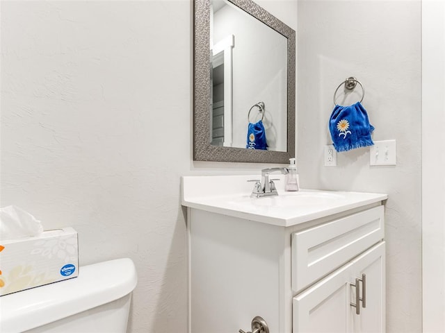 half bath with toilet and vanity