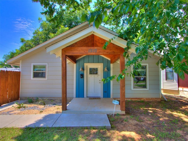 1510 NW 30th St, Oklahoma City, OK 73118 - entrance to property featuring fence and board and batten siding