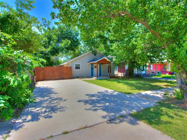 1510 NW 30th St, Oklahoma City, OK 73118 - view of front of property featuring a gate, concrete driveway, and covered porch