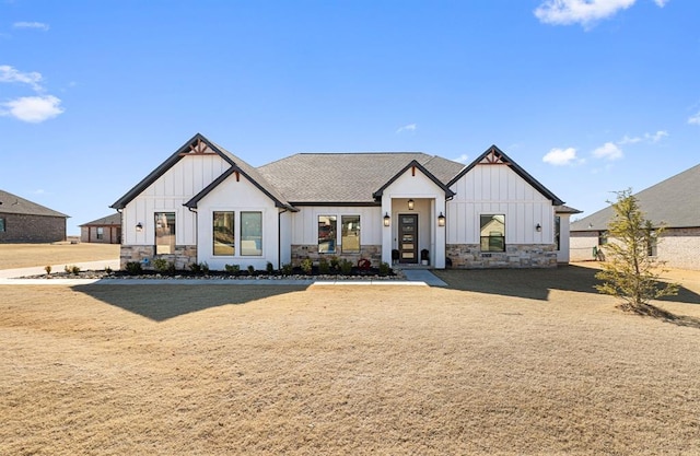 modern inspired farmhouse with a front yard