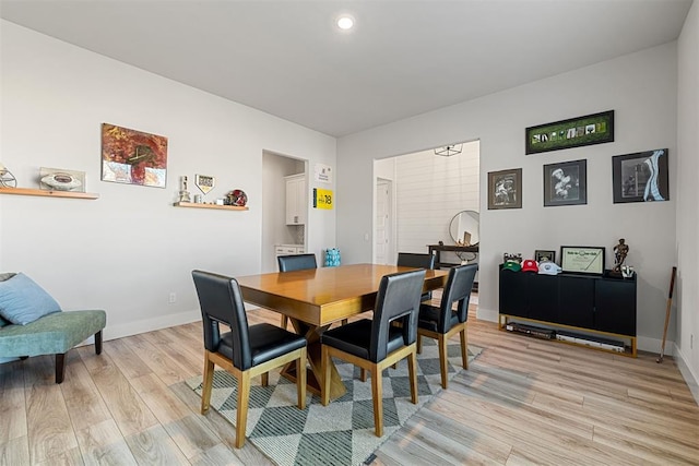 dining space featuring light wood-type flooring