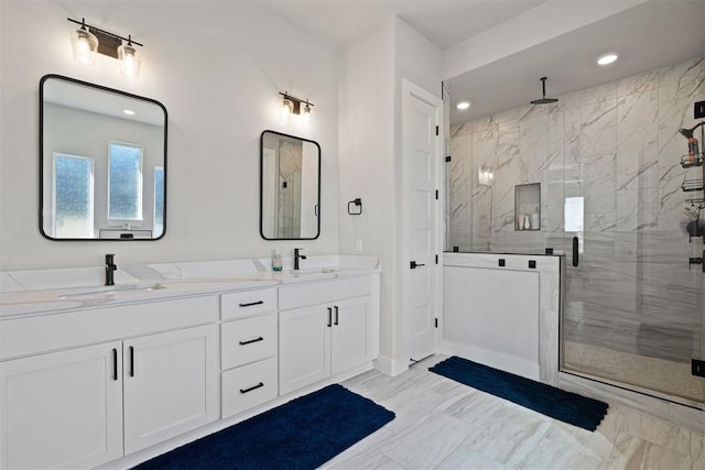 bathroom with vanity and a shower with shower door