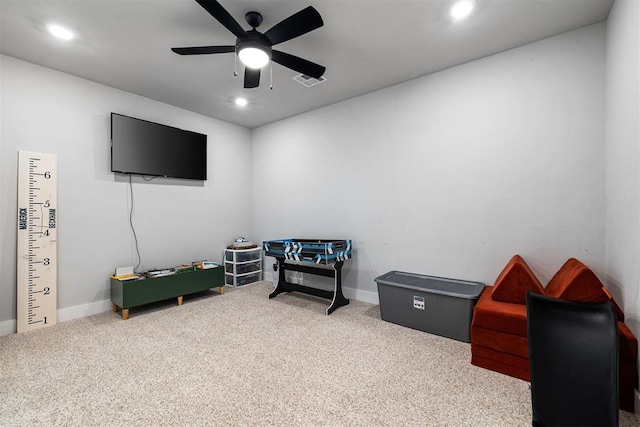 playroom with ceiling fan and carpet flooring