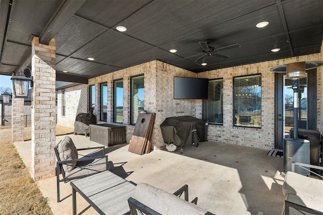 view of patio / terrace with grilling area and ceiling fan