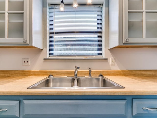 kitchen with wood counters and sink