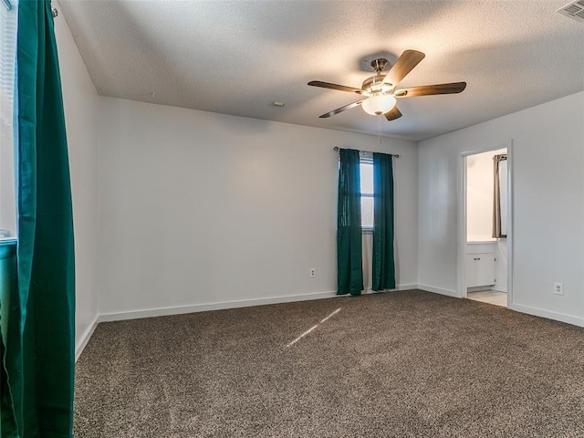 unfurnished room with carpet floors, a textured ceiling, and ceiling fan