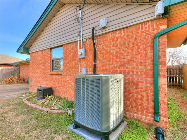 view of side of home featuring central air condition unit