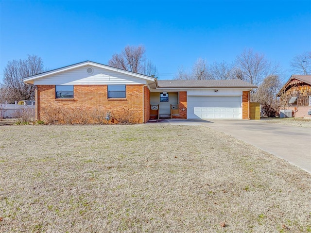 ranch-style house featuring a garage and a front lawn