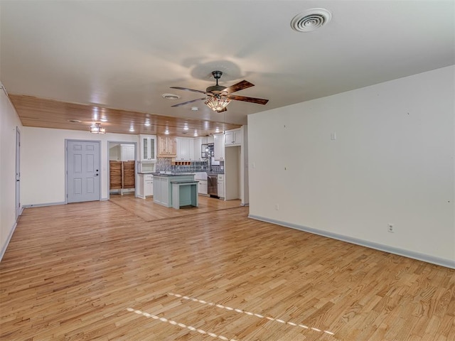 unfurnished living room with ceiling fan and light wood-type flooring