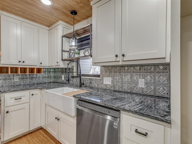 kitchen with pendant lighting, sink, dishwasher, tasteful backsplash, and white cabinets