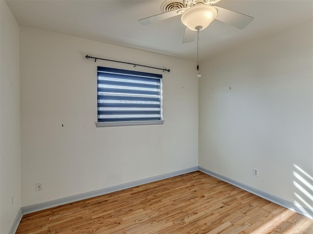 spare room featuring ceiling fan and light wood-type flooring