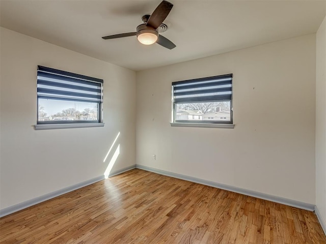 unfurnished room featuring ceiling fan and light hardwood / wood-style floors