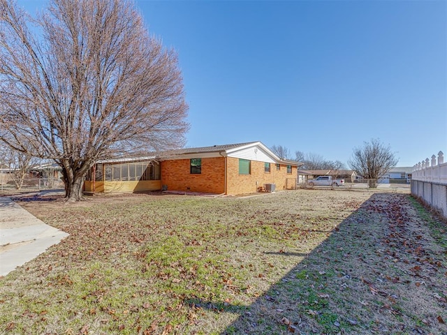 view of yard featuring a sunroom