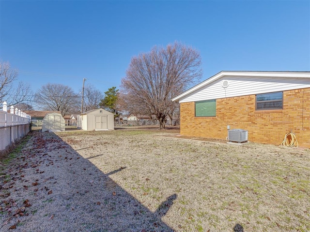 view of yard with a storage unit and central AC unit