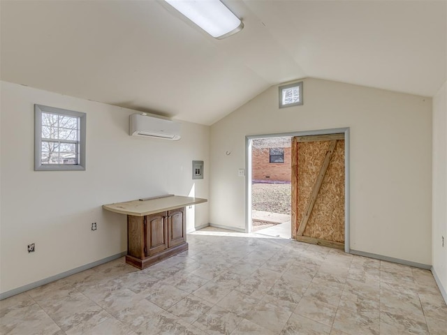 bonus room featuring vaulted ceiling and a wall unit AC