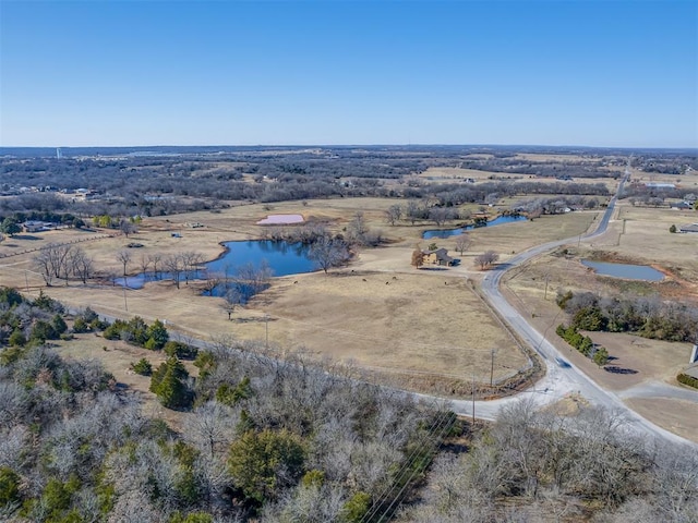 bird's eye view featuring a water view and a rural view