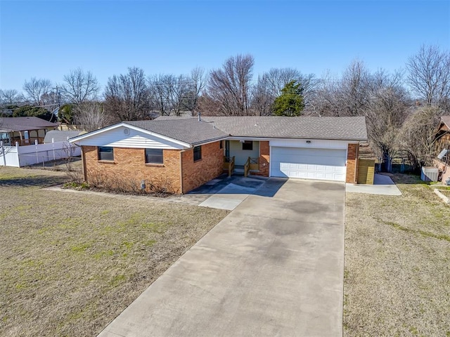 ranch-style house with a garage and a front yard