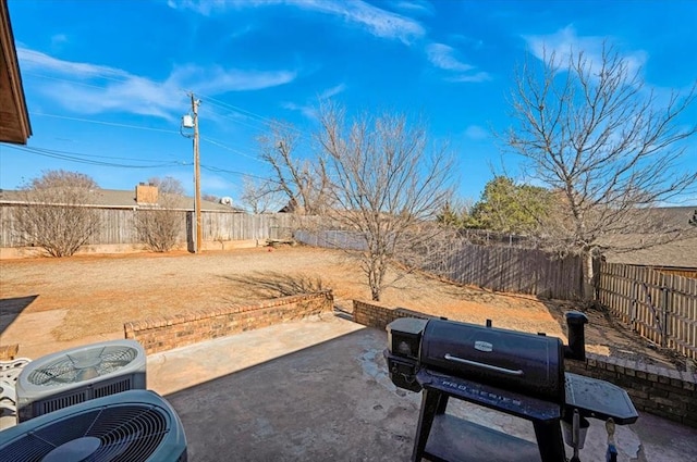 view of yard featuring central AC and a patio area