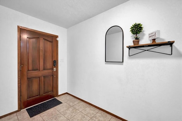 foyer with light tile patterned floors